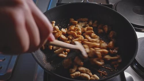 Diced Meat Stir Fry in Pan Close Up
