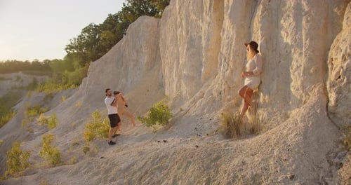 Young Adults Posing for Photos on Hillside