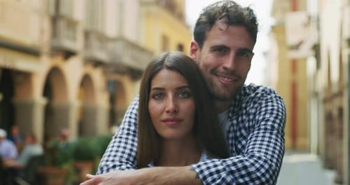 Couple Embracing on Picturesque City Street