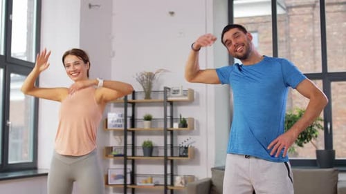 Sport, Fitness, Lifestyle and People Concept - Smiling Man and Woman Exercising