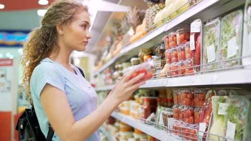 One Female Person Choose Products in Big Marketplace. 20s Cute Girl Stand