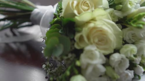 Close Up of Bridal Bouquet and Invitation