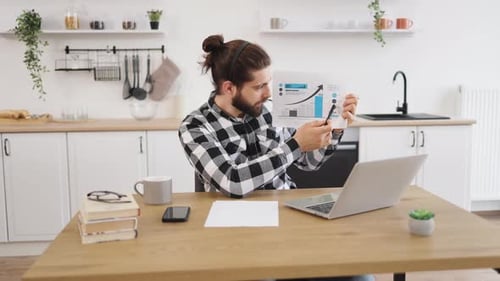 Young Adult Presents Business Data During Video Call