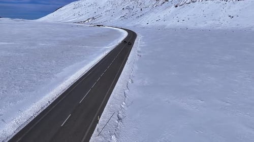 Aerial Drone View of Snowy Mountain Road in Abruzzo Italy