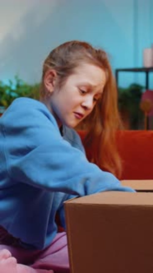 Upset Girl with Ponytail Opening Gift Indoors