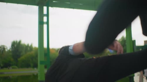 Young Man Practicing Martial Arts Moves Outdoors