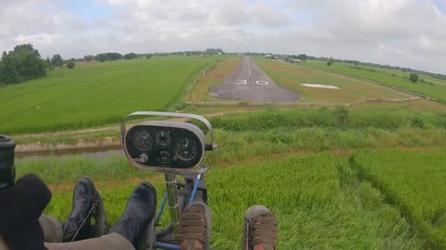 POV of ultralight airplane landing on the runway