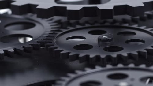 Close Up Shot Of Slowly Rotating Back Gears