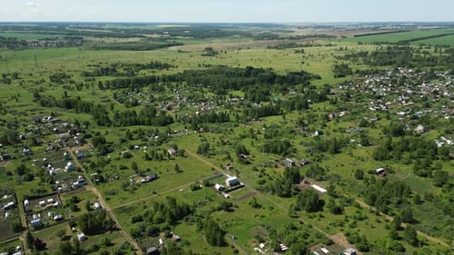 Aerial View Capturing Verdant Countryside Scattered Houses Nestled Among Lush Gardens and Mature