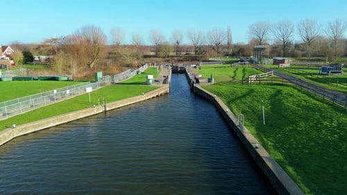 Aerial view of waterway and lock, United Kingdom.