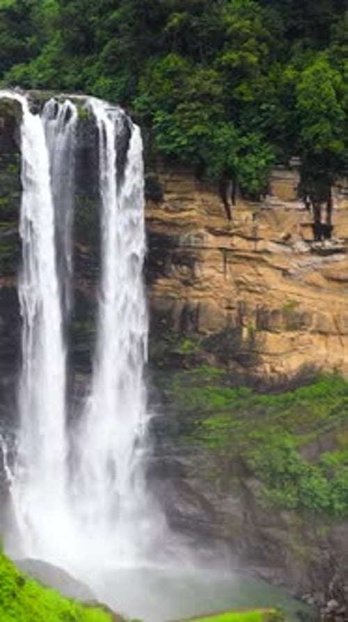 A Beautiful Waterfall in the Mountains Among the Jungle