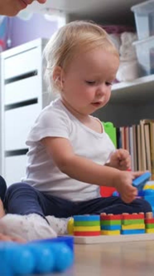 Joyful Baby Playing with Colorful Building Blocks