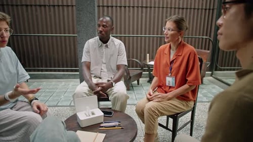 People in Support Group Sitting in Circle