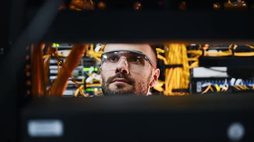 IT Technician Working in Data Center Server Room