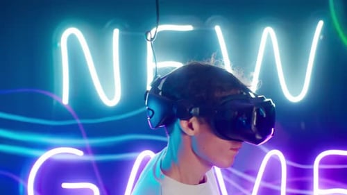 Young Adult Immersed in VR Gaming with Neon Lights