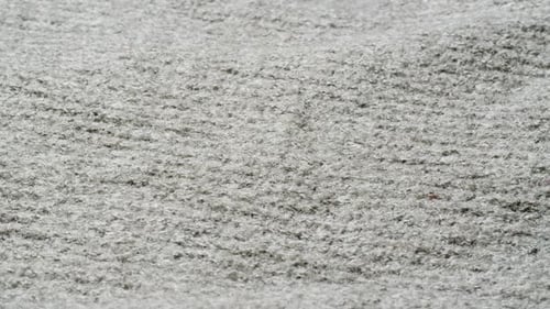 Knitted Warm Grey Sweater or Scarf Macro Close Up Texture Cozy Warm Composition of Wool Fabric