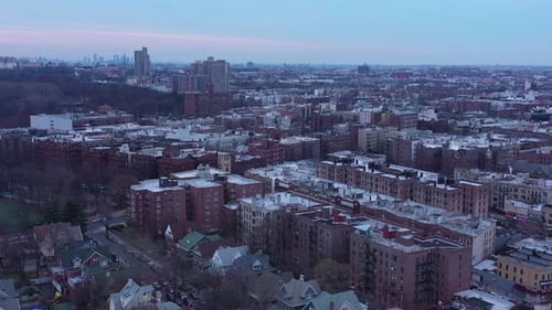 Drone pan down of Ditmas Park neighborhood of Brooklyn, New York. Full city view down to street int