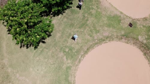 Aerial View of Golf Course Landscape and golfers