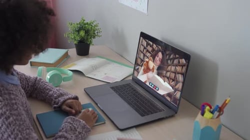 Cute African Primary School Kid Girl Distance Learning by Video Conference Call