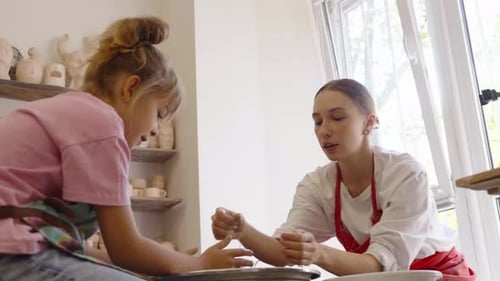 A Creative Pottery Session with a Child at an Art Studio in Early Spring