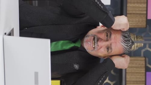 Angry Man Pounding Desk at Office Workplace