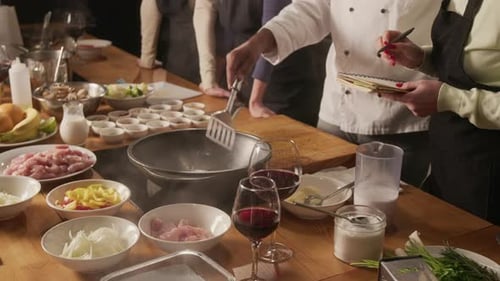 Close up of Unrecognizable Chef Stirring in Pan During Cooking Master Class