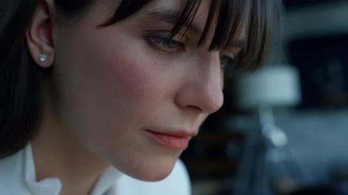 Attentive Businesswoman Thinking in Luxury Office