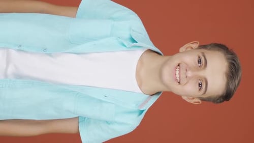 Smiling Teen Gives Thumbs Up and OK Sign