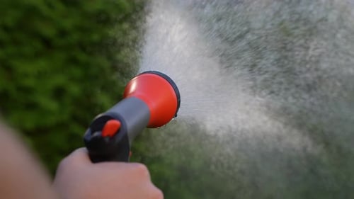 Watering in the Garden with Hose 56