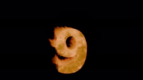 Burning digit nine 9 : charred, grainy crust with cracks and tongues of flame. Hot digit nine, tongu