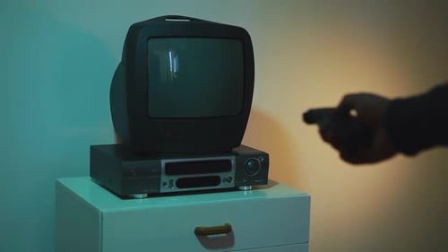 Turn on the Remote Control Vintage TV with Noise and Static Decrease