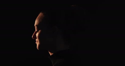 Silhouette of Woman's Face in Dramatic Lighting