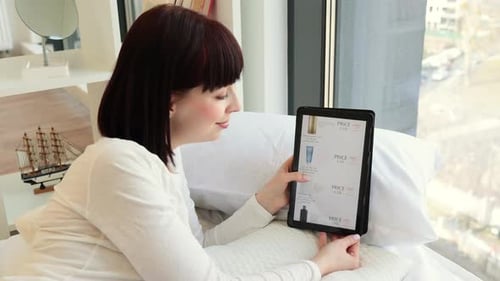 Woman Browsing Beauty Cosmetics Ecommerce Site on Tablet