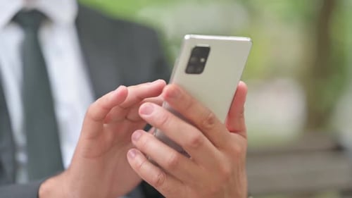 Close up of Male Hands Using Smartphone