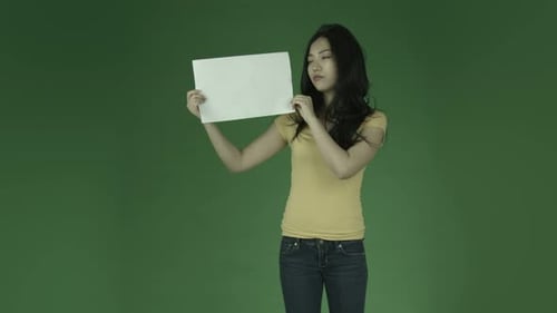 Attractive woman from east asia in her 20s isolated in studio