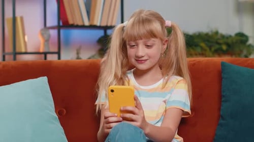 Girl Using Smartphone at Home