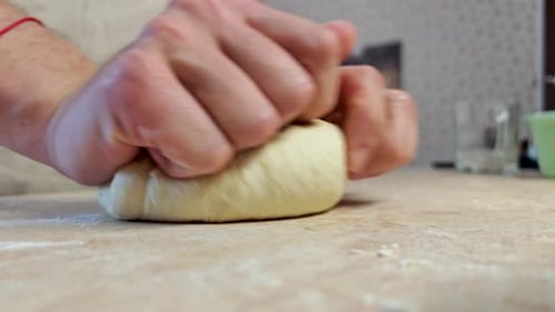 Hands Kneading Dough Close Up