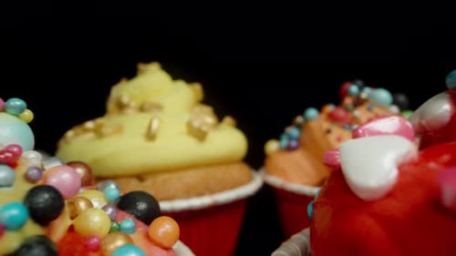 Delicious Colorful Cupcakes with Icing and Sprinkles