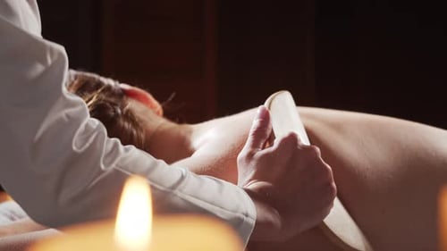 Young Healthy and Beautiful Woman Gets Massage Therapy in the Spa Salon The Concept of Healthy