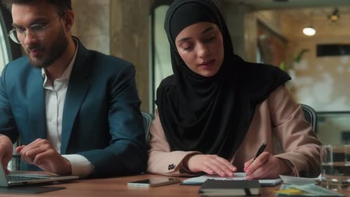 Business Colleagues Working Together at Table Indoors