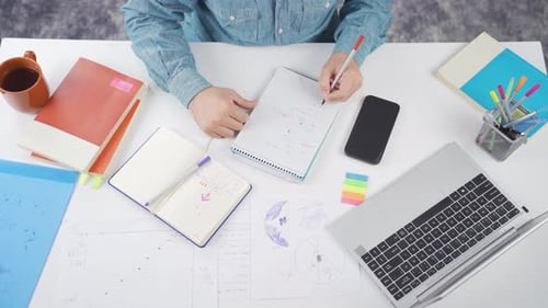 Studying at Desk Overhead in Modern Office