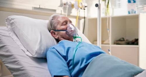 Sick, senior patient and oxygen mask in hospital bed for respiratory support, ventilation or coma