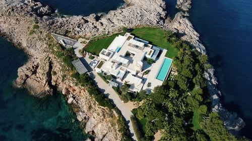 Aerial drone view of resort at Cala Benirras sea in Ibiza, Spain