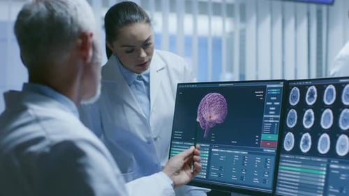 Doctors Examining Brain Scan in Hospital