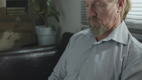 Caucasian Man Using Digital Tablet In Office