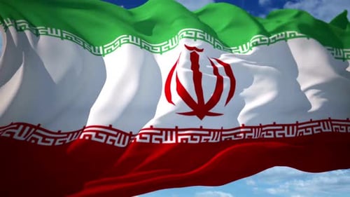 Waving Iranian Flag Against a Clear Blue Sky