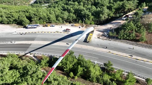 Aerial View Of Wind Turbine Transported On Highway