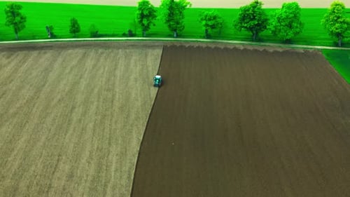 drone fly over field plowing tractor 4k