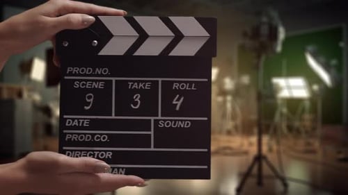 Human Hands are Using a Clapperboard on Set Beginning of Scene in Film or TV Television Production