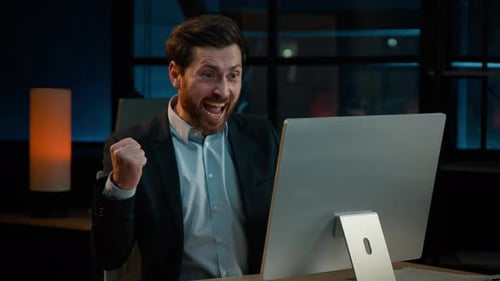 Overjoyed Caucasian Male Businessman Winner Employee Boss Investor Office Worker Sit at Desk Work